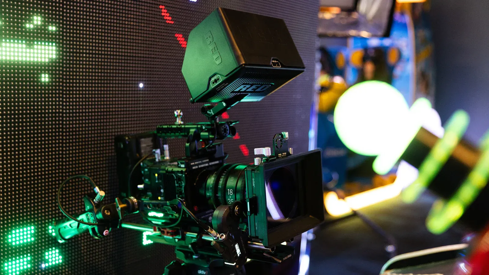 A camera rig on a neon-lit set