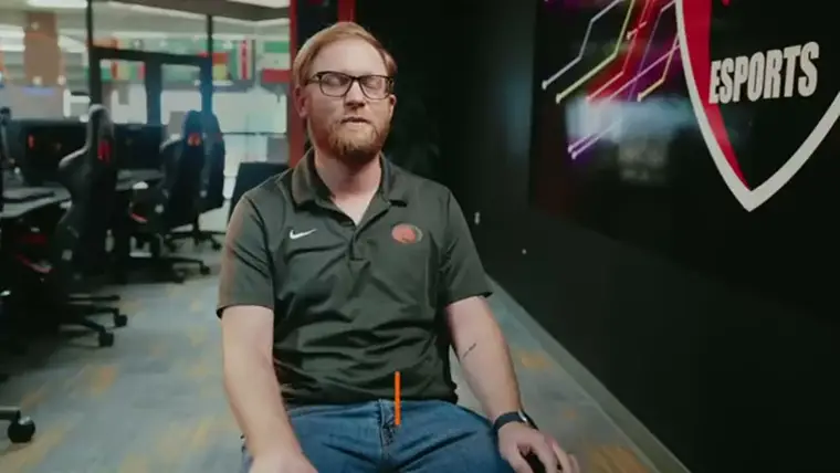 A program director speaking on camera in a recruitment film