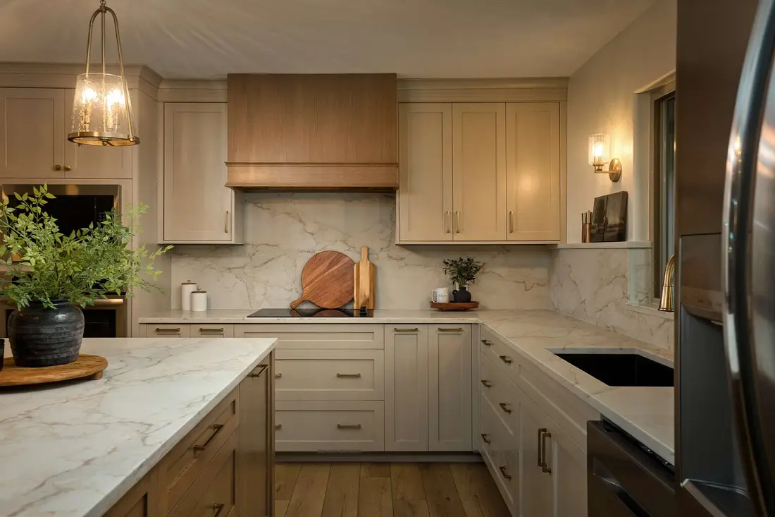 Warm kitchen interior with marble counters, shot for a listing